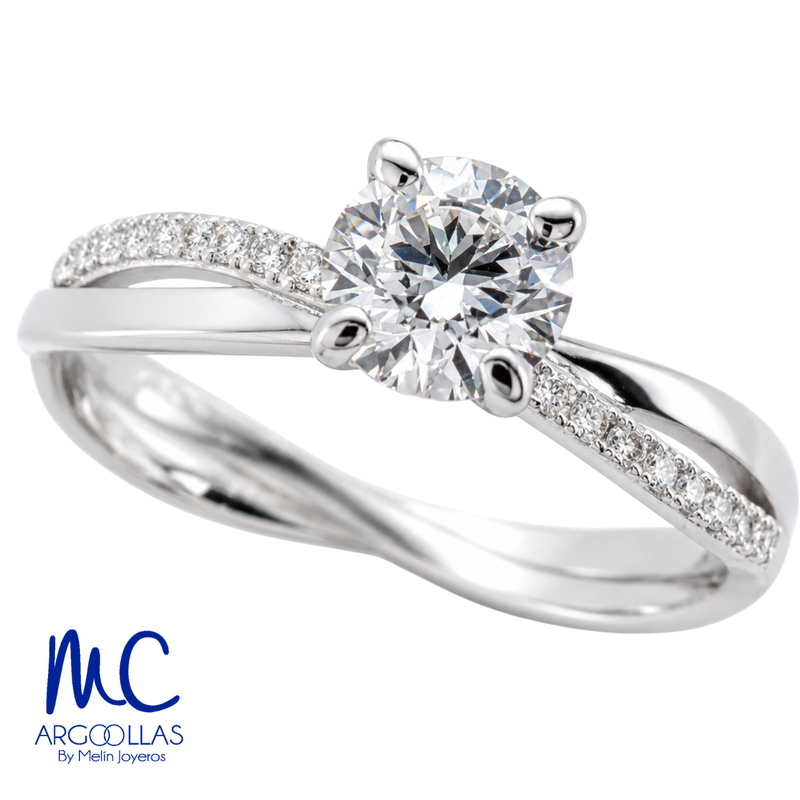 Anillo de compromiso de 0.57 ct · corte redondo brillante · color E · claridad VVS2 · oro blanco 14k